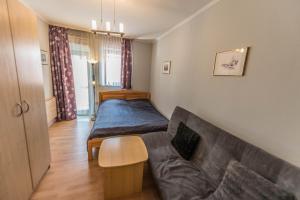 Posteľ alebo postele v izbe v ubytovaní Caesar Apartments & Rooms