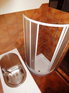 a bathroom with a metal toilet in the floor at Frank's Backpackers in Helmond