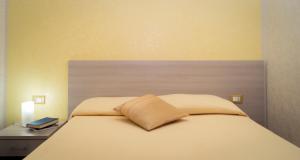A bed or beds in a room at B&B Alta Marea Pozzallo
