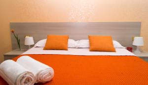 A bed or beds in a room at B&B Alta Marea Pozzallo