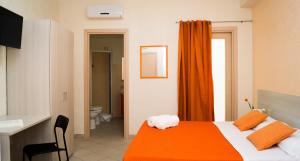 A bed or beds in a room at B&B Alta Marea Pozzallo