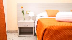 A bed or beds in a room at B&B Alta Marea Pozzallo