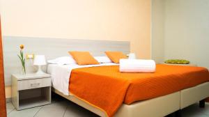 A bed or beds in a room at B&B Alta Marea Pozzallo