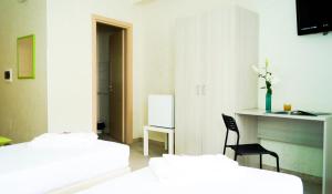 A bed or beds in a room at B&B Alta Marea Pozzallo