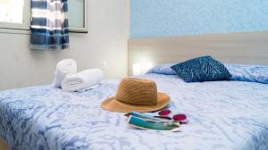 A bed or beds in a room at B&B Alta Marea Pozzallo