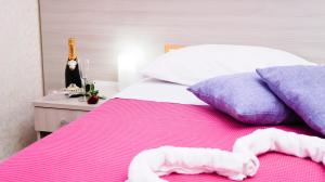 A bed or beds in a room at B&B Alta Marea Pozzallo