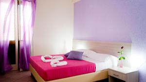 A bed or beds in a room at B&B Alta Marea Pozzallo