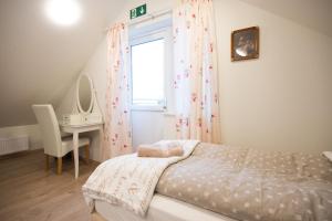 Ένα ή περισσότερα κρεβάτια σε δωμάτιο στο Guesthouse Grund