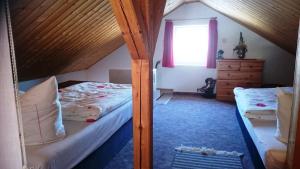 Ένα ή περισσότερα κρεβάτια σε δωμάτιο στο Ferienhaus Brigitte