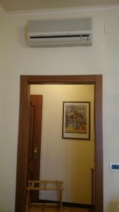 a room with a air conditioner on the wall at Hotel Pescetto in Albenga