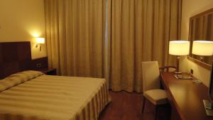 Posteľ alebo postele v izbe v ubytovaní Hotel Marconi