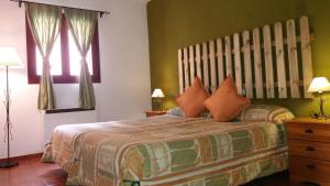 En eller flere senge i et værelse på Rural Arco Iris