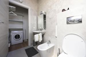 a bathroom with a sink and a washing machine at B&B Fiera Milano Rho in Pero +61 photos