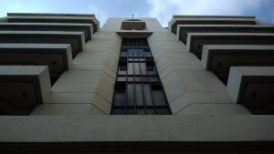 a view from the bottom of a tall building at Ralph Anthony Suites in Manila