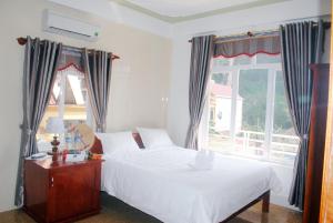 Кровать или кровати в номере Paradise Hotel