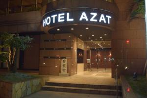 a hotelzaat sign on the front of a building at Hotel Azat Naha in Naha