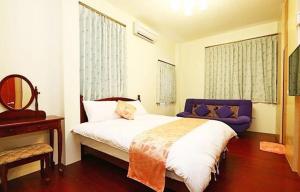 Voodi või voodid majutusasutuse 宜蘭樂活小屋 toas