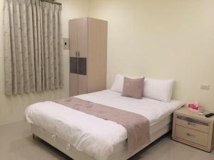 Voodi või voodid majutusasutuse 宜蘭樂活小屋 toas