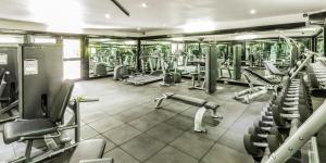 a gym with lots of treadmills and machines at Tokatoka Resort Hotel in Nadi