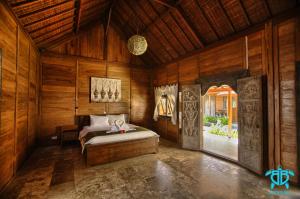 Postel nebo postele na pokoji v ubytování Benthos Bali Dive Resort