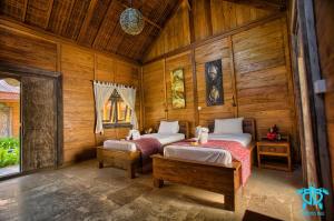 Postel nebo postele na pokoji v ubytování Benthos Bali Dive Resort + 37 fotografií