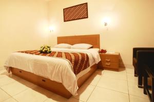 Voodi või voodid majutusasutuse Syariah Arini Hotel toas