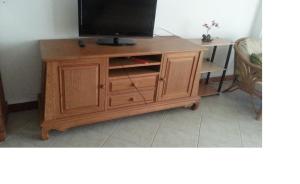 a wooden entertainment center with a television on top at View Talay resort 5c condo 115A minimum stay 29 nights in Pattaya South