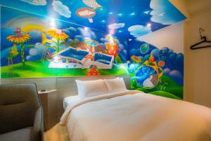 Postel nebo postele na pokoji v ubytování Legend Hotel Kaohsiung Pier2