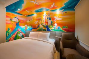 Postel nebo postele na pokoji v ubytování Legend Hotel Kaohsiung Pier2