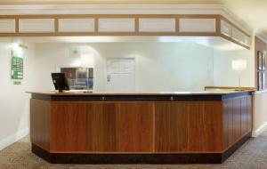 a lobby with a reception desk in a hotel room at Coventry Hotel By Belvilla near City Centre in Coventry