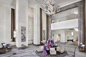 a rendering of a lobby with a chandelier at Address Boulevard in Dubai