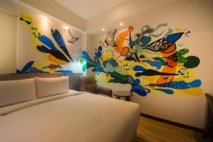 Postel nebo postele na pokoji v ubytování Legend Hotel Kaohsiung Pier2
