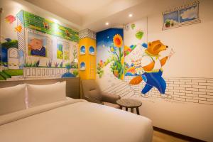 Postel nebo postele na pokoji v ubytování Legend Hotel Kaohsiung Pier2