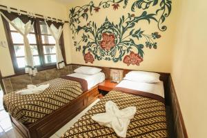 Postel nebo postele na pokoji v ubytování Delta Homestay