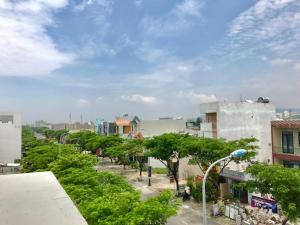 a view of a city street with trees and buildings at Gia Loi Hotel in Danang