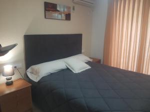 Postel nebo postele na pokoji v ubytování Hotel L'Escala