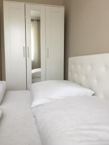 Posteľ alebo postele v izbe v ubytovaní Dado Apartments