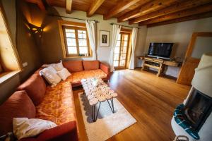 a living room with a couch and a table at Ferienhaus Feistritz in Feistritz ob Bleiburg