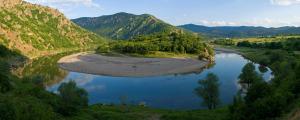 an aerial view of a river in a valley at Vulture Centre Eastern Rhodopes in Madzharovo