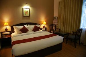 A bed or beds in a room at The Ruby Arena