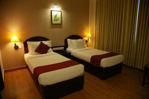 A bed or beds in a room at The Ruby Arena