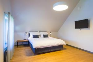 Postel nebo postele na pokoji v ubytování Zoltners Hotel