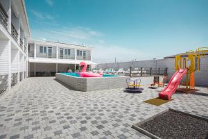 a pool with a slide and a playground at SeaZone in Zatoka