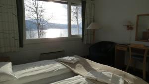Postel nebo postele na pokoji v ubytování Fjellkysten