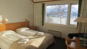 เตียงในห้องที่ Fjellkysten