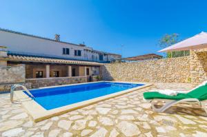 a swimming pool in front of a villa at Son Ramon in Sant Joan