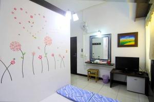 TV a/nebo společenská místnost v ubytování Luyi Ludao B&B