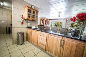 A kitchen or kitchenette at First Group Lake View Cabanas