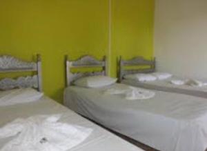 Ein Bett oder Betten in einem Zimmer der Unterkunft Pousada Jardim