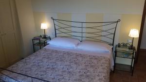 Postel nebo postele na pokoji v ubytování Agriturismo La Quiete